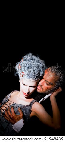 Couple on black background passionately touching each other, frost faces