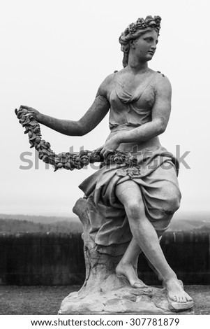 black and white garden statue of woman