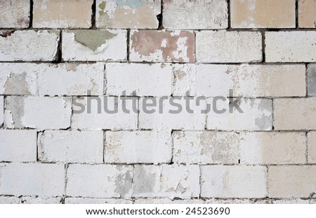 Old white washed cement brick wall, perfect for graffiti message.