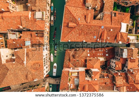 Similar – Image, Stock Photo Gondolas sailing along canal between city buildings