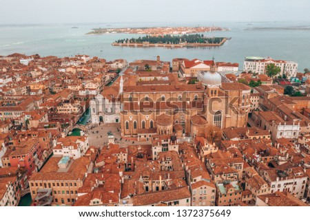 Similar – Image, Stock Photo Gondolas sailing along canal between city buildings