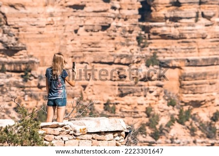 Image, Stock Photo Woman photographing rocky formations on smartphone