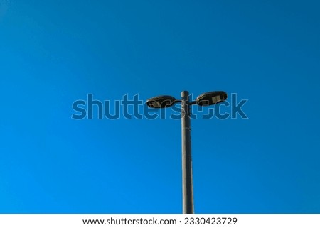 Similar – Image, Stock Photo Wild connected light bulb with cable net in a socket in front of a palm tree