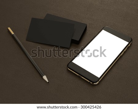 Black business cards blank and smartfon mockup on leather background High resolution