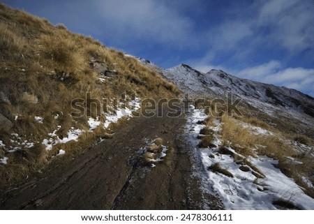 Similar – Image, Stock Photo Snowy hiking trail with legs