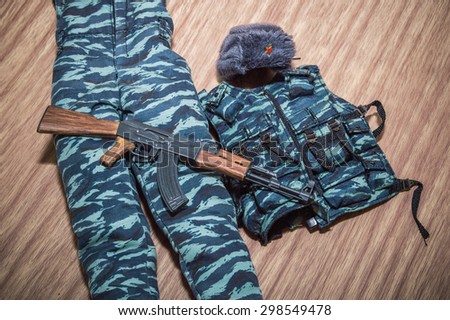 police russia uniform soldiers accessory and gun for toy scale on woods texture and woods backgrounds