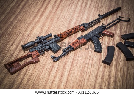 select focus toy gun and weapons and toy scale on woods texture and woods backgrounds