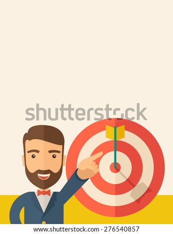 A Caucasian salesman happy standing while his hand pointing to the arrow from target pad shows that he hit his target sales. Business concept. A Contemporary style with pastel palette, soft beige