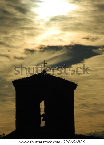 The voice of God - A bell tower with clouds