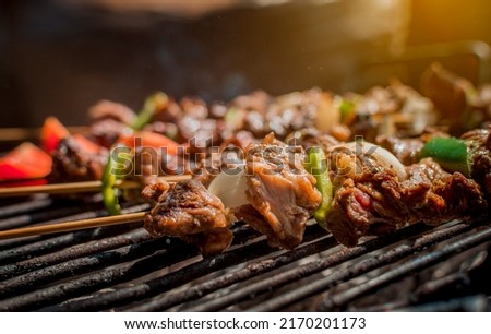 Roast beef skewers on a grill, Roast beef skewers grilling on a grill, Roast beef concept ストックフォト © 