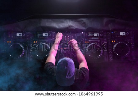 Similar – Image, Stock Photo DJ mixing music during party in club