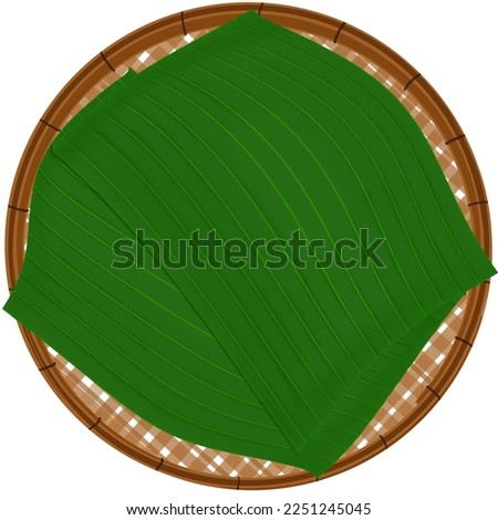 Traditional Thai Threshing basket with Banana Leaf. Kitchenware, Hand weaving circular trays made from the bamboo strip. Bamboo basket weave and banana leaf cut out, empty basket weave bamboo