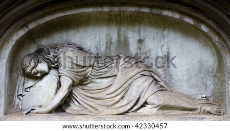 A mourning woman, prostrate with grief, is built into a wall recess in this fine monument  in an Edinburgh cemetery.
