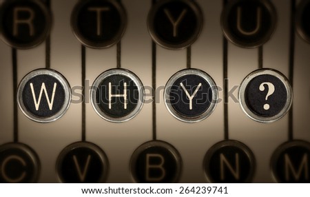 Close up of old manual typewriter keyboard with scratched chrome keys that spell out \