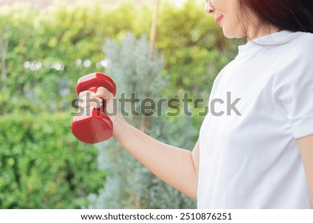 Image, Stock Photo Smiling overweight ethnic sportswoman against fence and sea