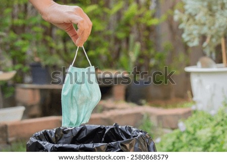 Similar – Image, Stock Photo Woman holds protective mask in hands at city street