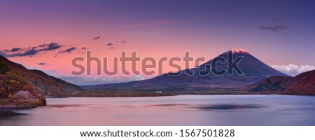 Last light on the peak of the iconic Mount Fuji (Fujisan, 富士山) in Japan. Photographed from Lake Motosu (Motosuko, 本栖湖) at sunset. 商業照片 © 