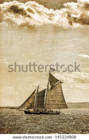 Tall ship under sail with storm clouds overhead. Vintage toning and texture.