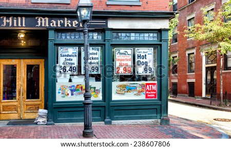 BOSTON-MAY 30, 2010: Old fashioned corner grocery store in the historic Beacon Hill neighborhood, where buildings and sidewalks are still constructed of red brick and a gas street lamp flickers.