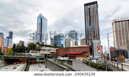 SEATTLE-NOV. 26, 2014: A view of downtown Seattle high rises with the I-5 Freeway in the foreground. The Washington State Convention Center is pictured extending over the freeway.