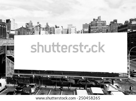 Big blank billboard sign in New York City, surrounded by highrise buildings. Black and white image ready for custom copy.