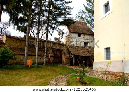 Courtyard of the medieval fortified saxon church in the village Crit, Transylvania. The villagers started building a single-nave Romanesque church, which is uncommon for a Saxon church, in the 13th ce Photo stock © 