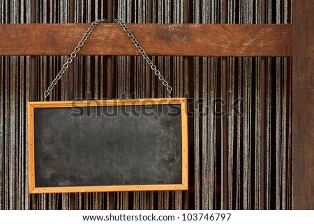 Blank old blackboard label  hanging with metal chain