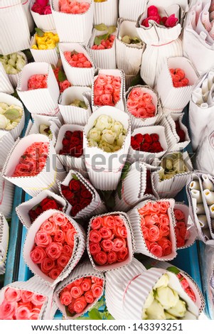 Bright color roses wrapped in shop