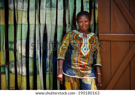 ACCRA, GHANA - MARCH 18: Unidentified African woman pose and look at camera on March 18, 2014 in Accra, Ghana. Ghana is one of the most popular  tourists destination in Africa.