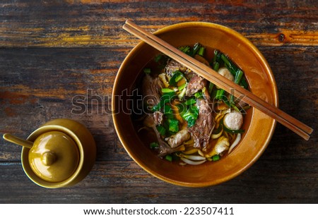 Chinese clear soup in traditional ceramic bowl