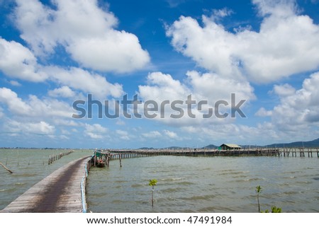 Bridge to fisherman house in southern Thai sea