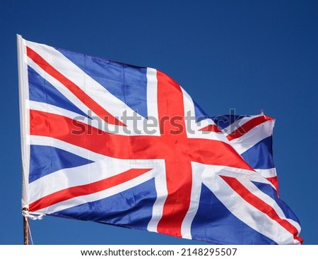 Closeup of Great Britain Flag Waving, Flag of the United Kingdom Waving in Wind on Clear Sky. British National Flag. Union Jack. Great Britain Flag Of Silk On Blue Background
 商業照片 © 