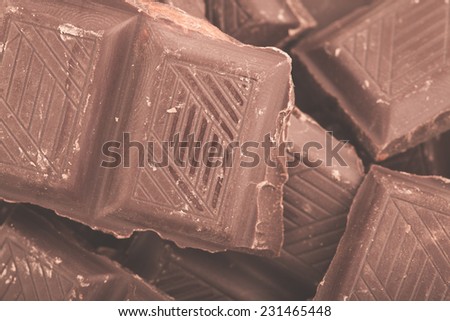 Pieces of milk chocolate closeup. Macro photo