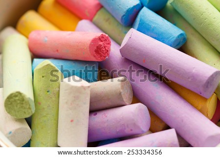 Colorful crayons for drawing on the pavement close-up