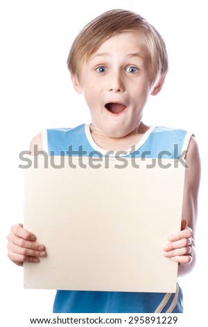 A blond boy holding a blank ad sign isolated on a white background