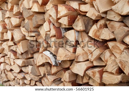 Woodpile of birch fire wood. A pile of cut wood to be used as fuel