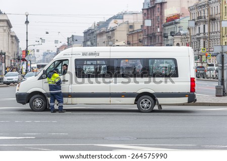 SAINT-PETERSBURG, RUSSIA - MARCH 28: Policeman talking with driver of the bus. March 28, 2015.