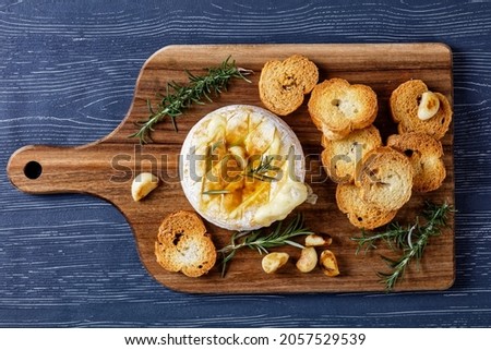 Similar – Image, Stock Photo Baked camembert served on wooden table