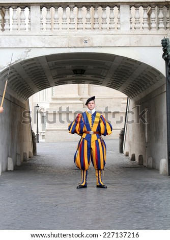 ROME, ITALY - OCTOBER 13, 2014: Handsome young Italian Swiss guard on duty in Vatican City Rome Italy