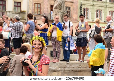 LVIV, UKRAINE - JULY 22: Unknown fans of soccer sing anti-Russian and against V.Putin songs in connection with military aggression of Russia against Ukraine in the Ukraine on July 22, 2014 in Lviv.
