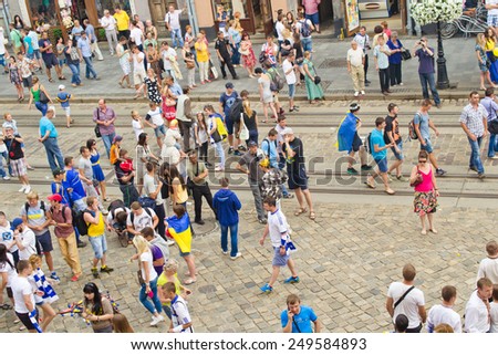LVIV, UKRAINE - JULY 22: Unknown fans of soccer sing anti-Russian and against V.Putin songs in connection with military aggression of Russia against Ukraine in the Ukraine on July 22, 2014 in Lviv.