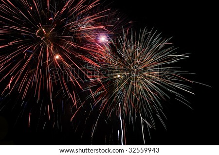 Large beautiful mulitple fireworks burst with many colors, sparkles, stars and twinkles, horizontal with copy space