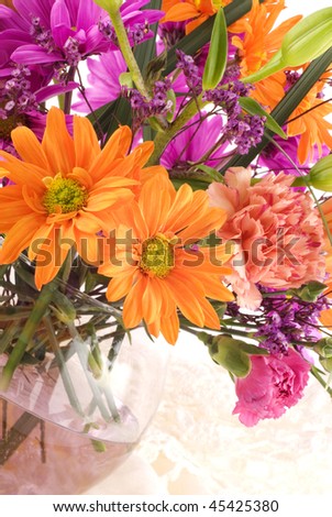 A colorful flower arrangement on a vertical high key background with copy space, perfect for Mother\'s Day or Easter