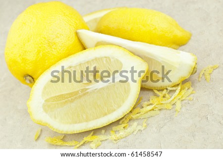 Fresh cut lemons with lemon zest for seasoning, horizontal with copy space
