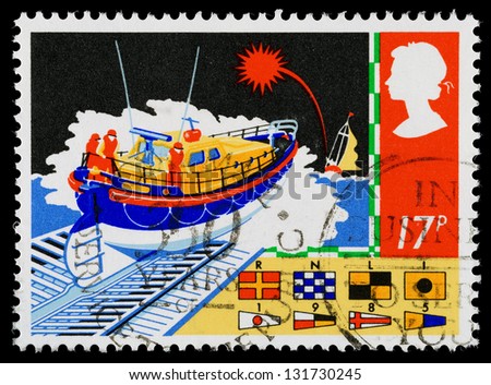 UNITED KINGDOM - CIRCA 1985: A used postage stamp printed in Britain showing a RNLI Lifeboat Launch and Signal Flags for Safety at Sea, circa 1985
