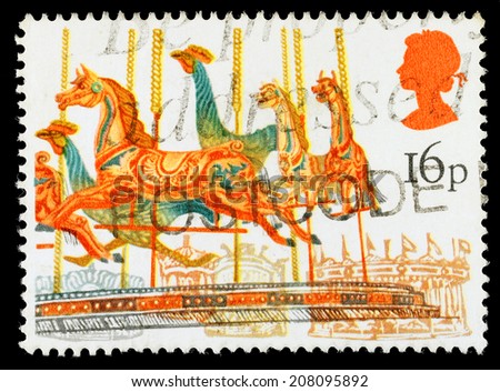 UNITED KINGDOM - CIRCA 1983: A used postage stamp printed in Britain celebrating British Fairs showing a Carousel Merry Go Round Amusement Ride