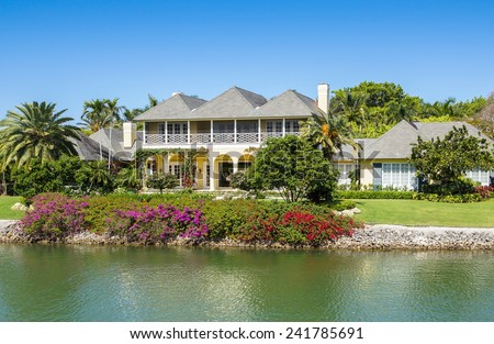 NAPLES, FLORIDA USA - May 8 2013: Waterfront  house with colourful gardens on the bayside area of Naples. Naples is one of the wealthiest cities in the United States
