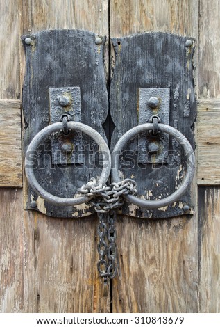 Chained and Locked Wooden Door Closeup