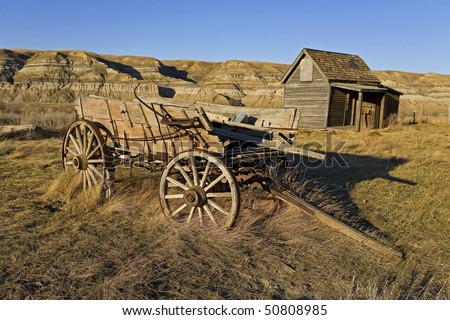 traditional western landscape with abandoned cart and shack