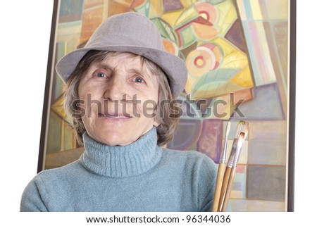 senior artist woman in front of painting